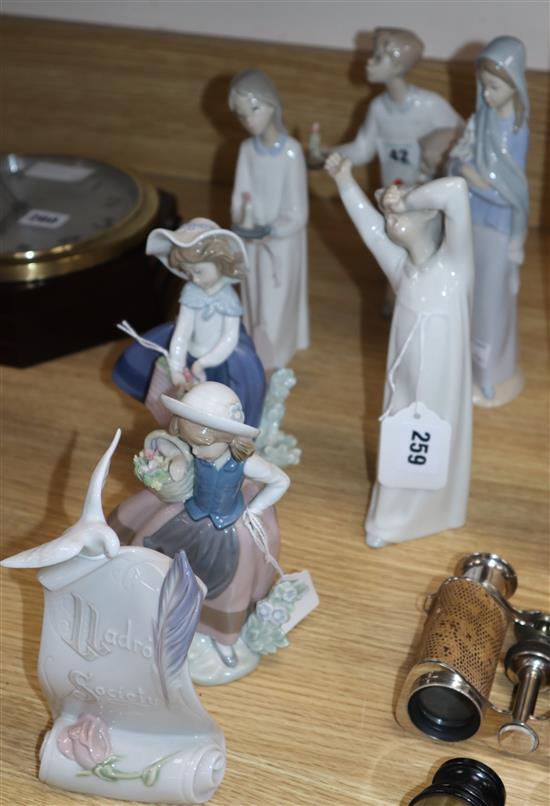 Six Lladro figurines of children and a Lladro Society plaque